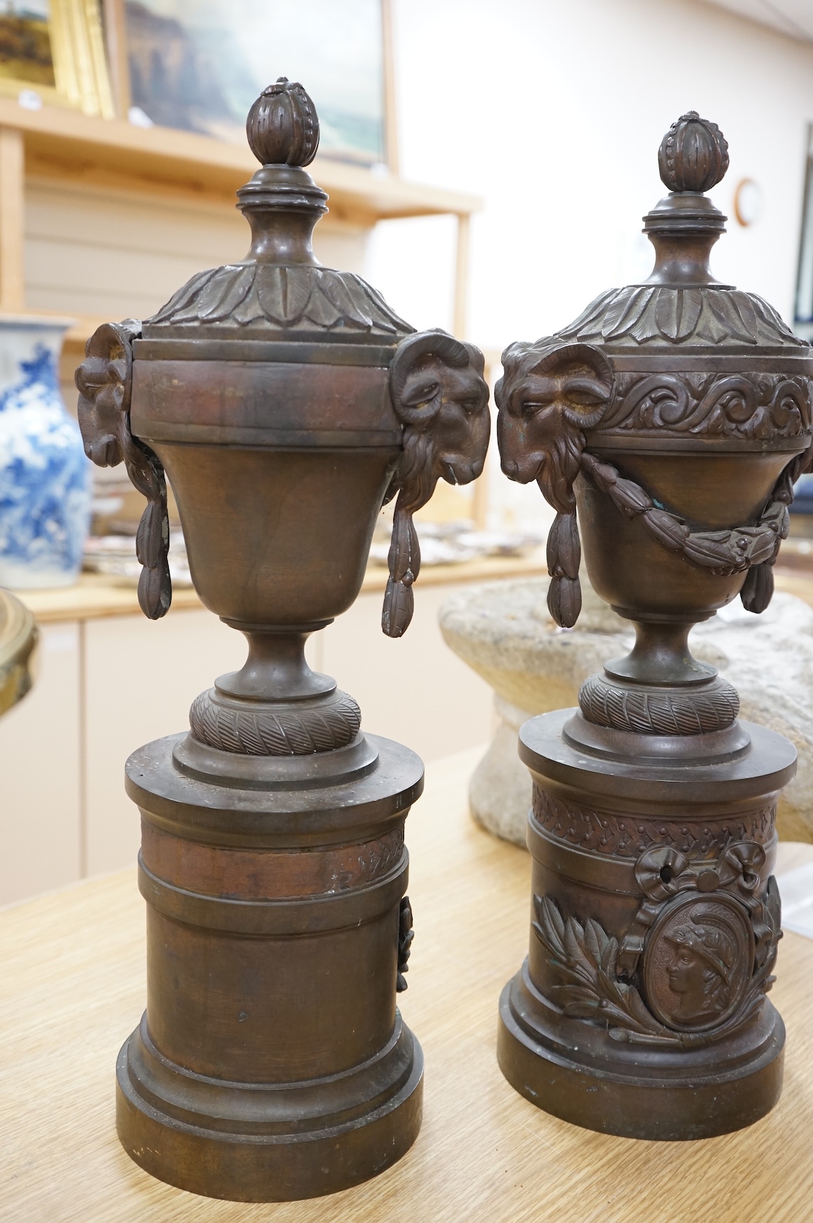 A pair of Grand Tour style bronze rams' head vases, H 55cm W 18cm